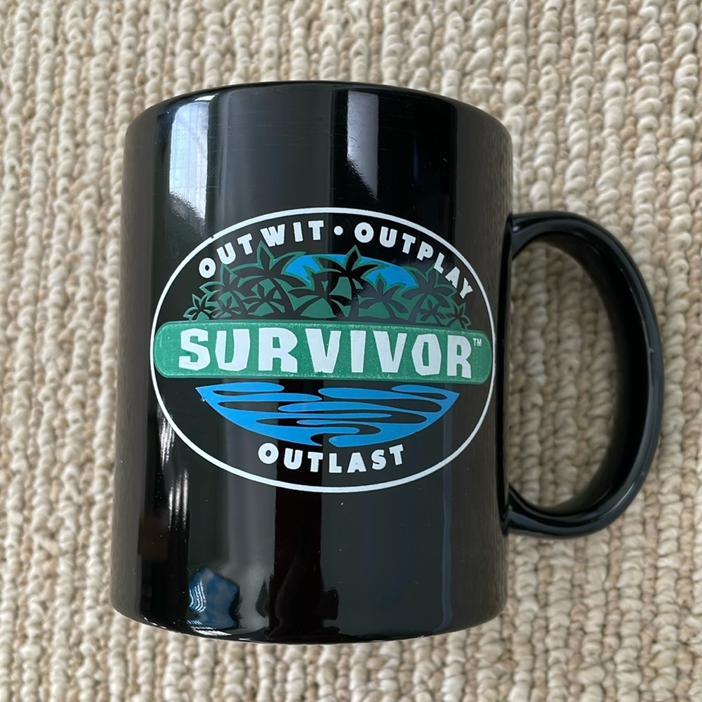 Survivor black coffee mug. Great condition. No chips
